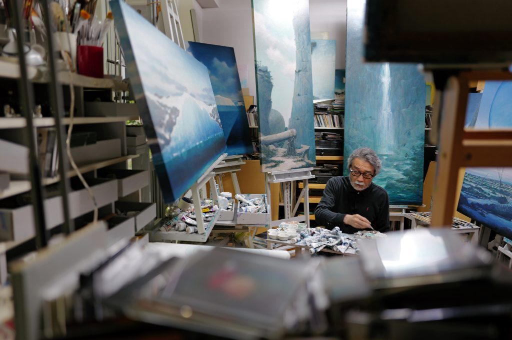 Minoru-Nomata-sitting-in-the-studio